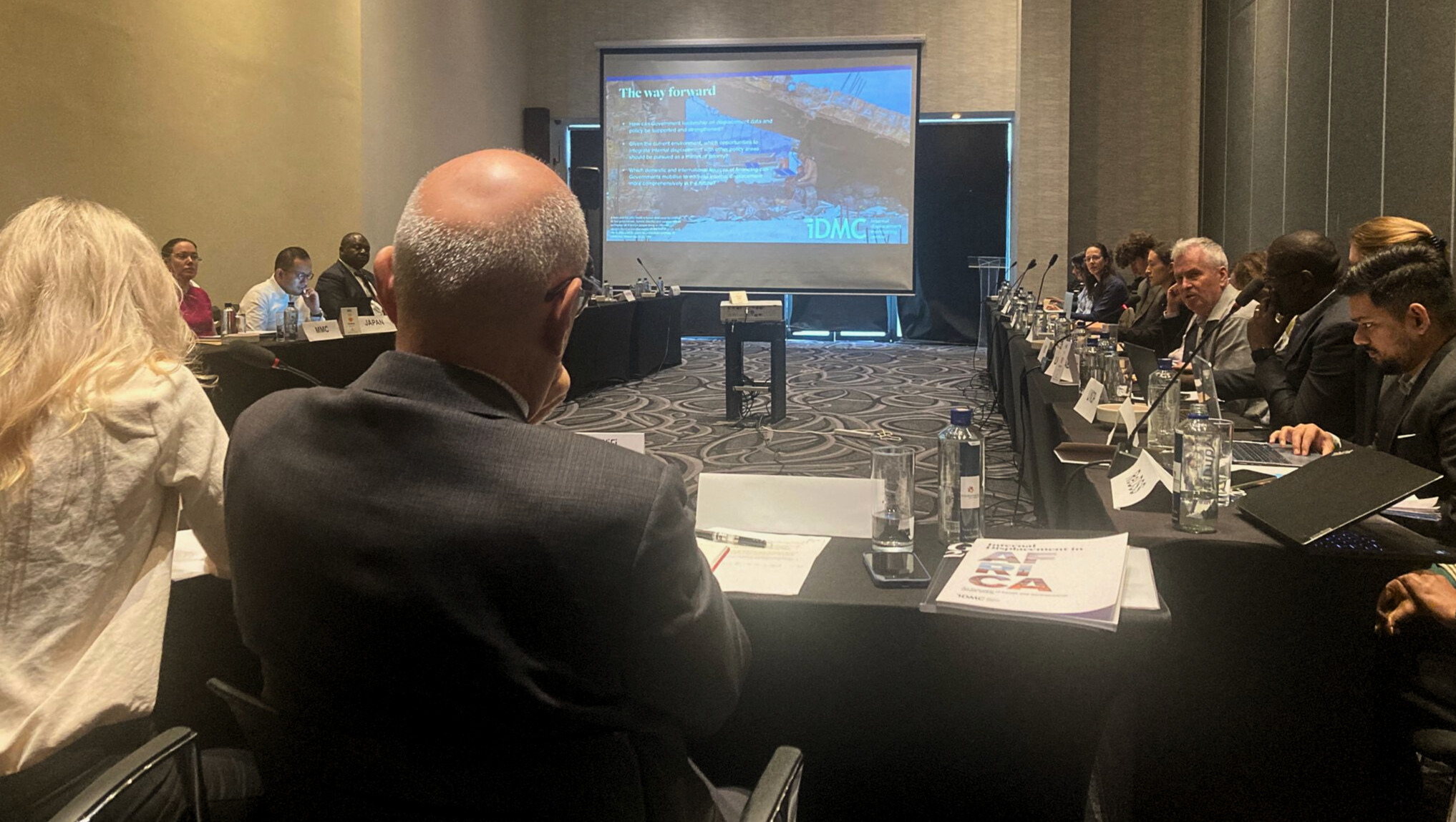 Representatives from governments, international organizations and non-governmental organizations exchange experiences, including challenges and successes, in driving solutions to internal displacement. Photo: IDMC, 2025